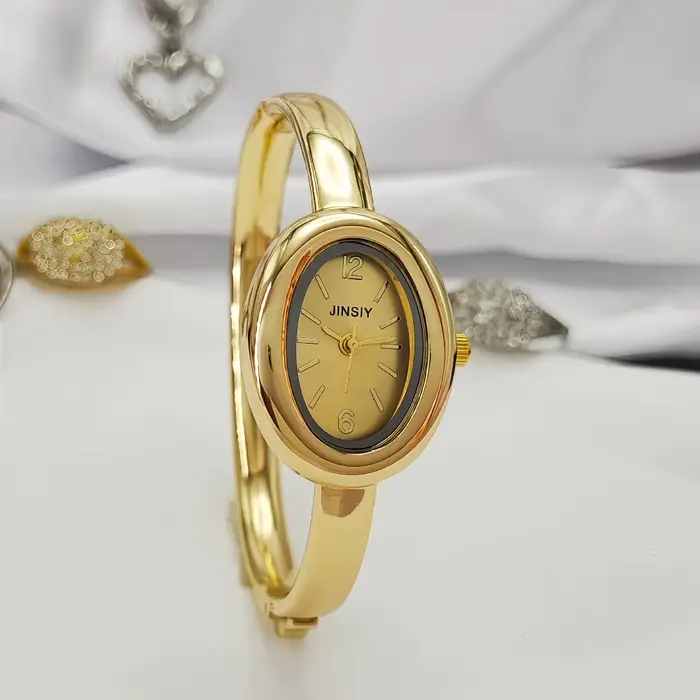 Montre-bracelet dorée en alliage avec bracelet en acier inoxydable pour femmes élégantes occasions spéciales style mode et décontracté