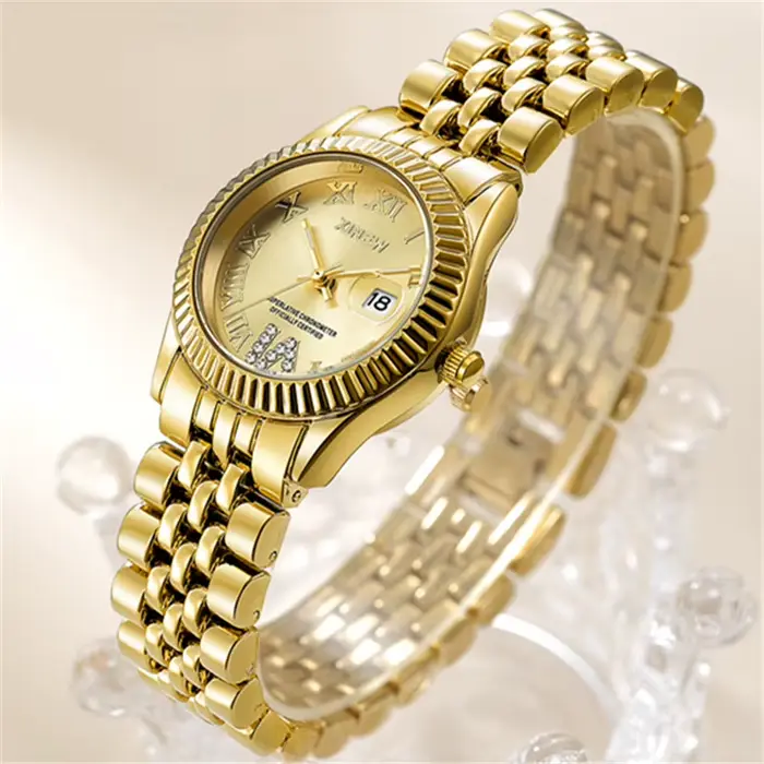 Montre XINEW à Quartz dorée avec calendrier complet pour femmes occasions spéciales