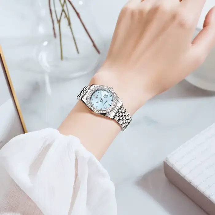 Montre à Quartz Luxe Femmes Planète Collection Calendrier Lumineux Bracelet Acier Occasions Spéciales Robuste et Élégante