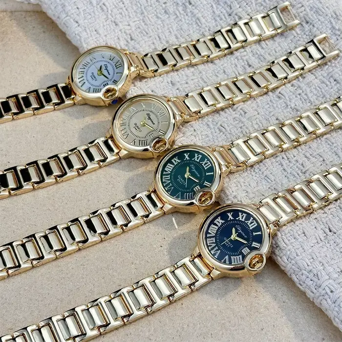 Montre-bracelet élégante pour femmes avec bracelet en acier allié et affichage en chiffres romains pour les occasions spéciales et quotidiennes
