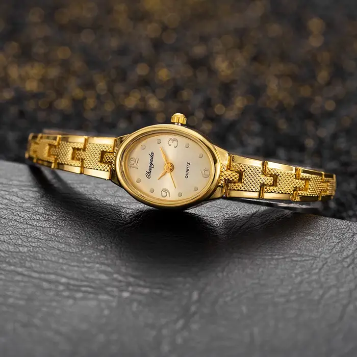 Montre en or JBAILI pour femme élégante avec cadran ovale mouvement quartz occasion spéciale cadeau