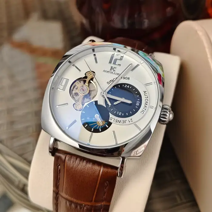 Montre mécanique AOKULASIC avec cadran squelette design ajouré boîtier en alliage bracelet cuir pour homme élégance polyvalence occassions professionnelles décontractées