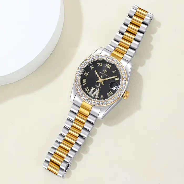 Montre à quartz de luxe pour femme bracelet en acier inoxydable bicolore lunette sertie de strass cadran à chiffres romains avec affichage de la date pour femmes occasions spéciales