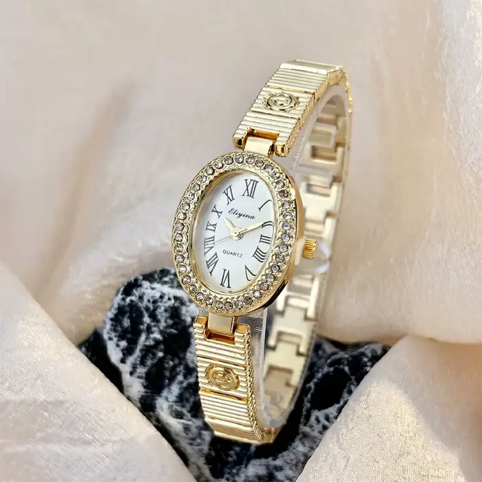 Montre élégante ovale pour femme avec lunette sertie de diamants et bracelet E-Design