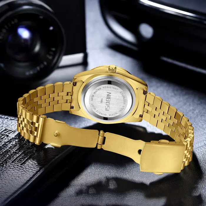 Montre NIBOSI en acier inoxydable avec fonction date et résistance à l'eau pour homme style luxueux affaires et occasions spéciales