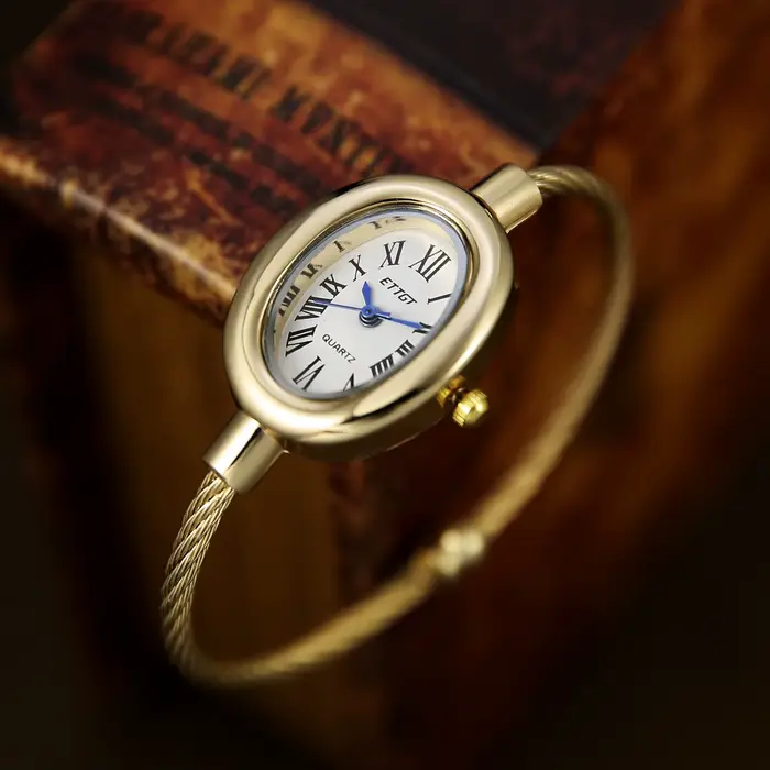 Montre-bracelet à quartz pour femme, bracelet ouvert doré, cadran ovale à chiffres romains, bracelet