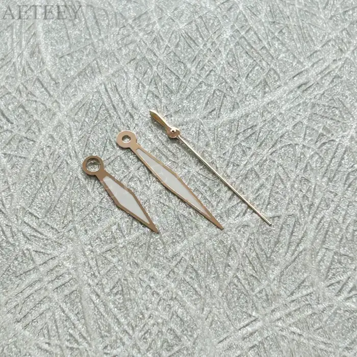 Aiguilles de montre or rose