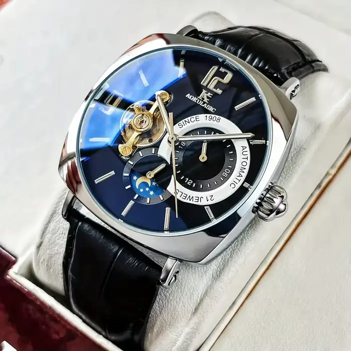 Montre mécanique AOKULASIC avec cadran squelette design ajouré boîtier en alliage bracelet cuir pour homme élégance polyvalence occassions professionnelles décontractées