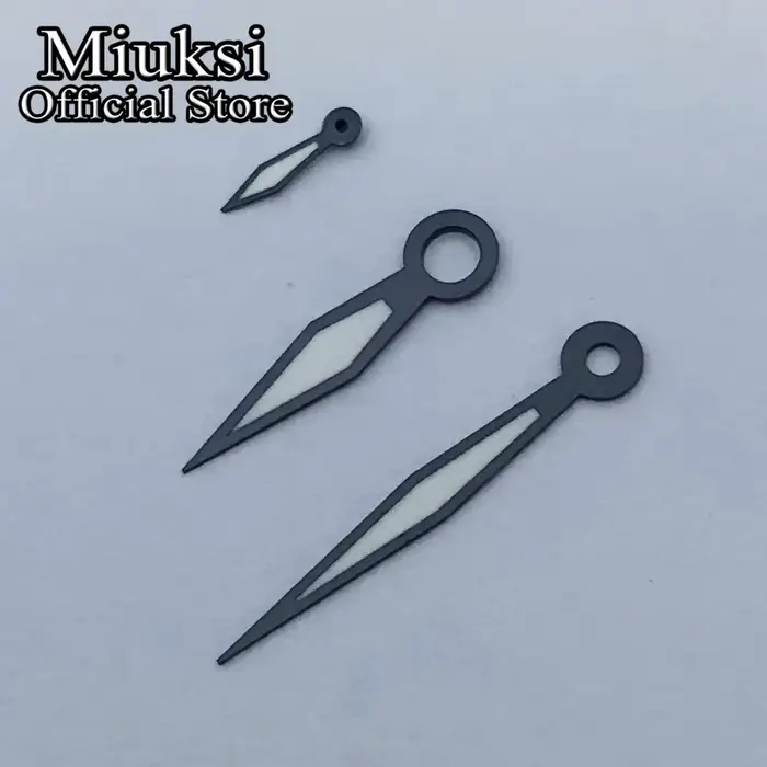 Miuksi – aiguilles de montre argent or noir blanc
