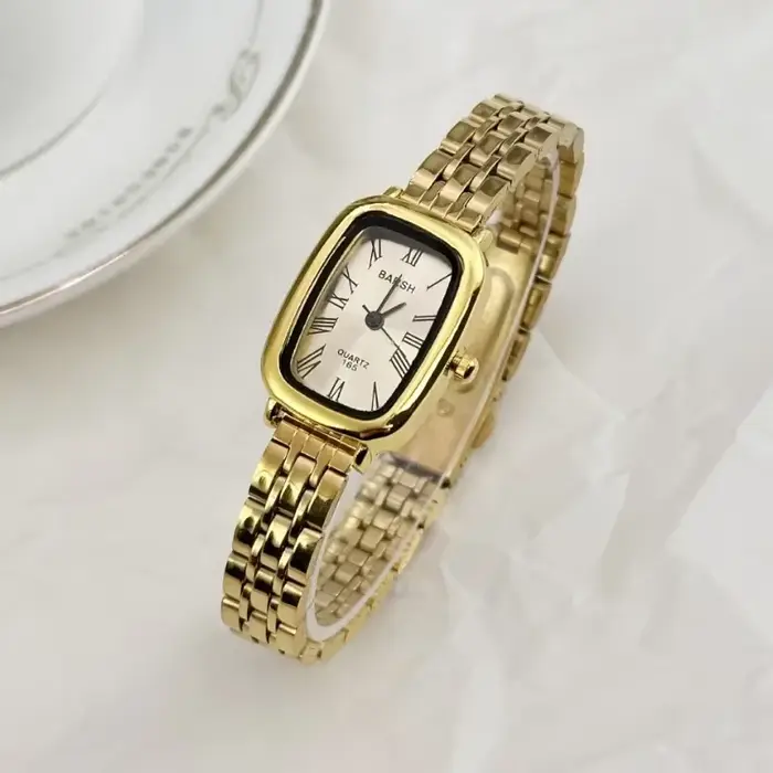 Montre en or avec ceinture en acier pour femme