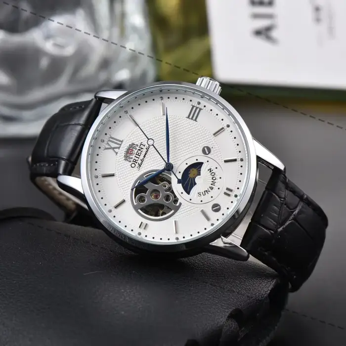 Montre sport mécanique Orient avec soleil, lune et étoiles pour homme, résistance à l'eau, cadran en acier inoxydable, bracelet en cuir, affichage de l'heure mondiale, pour homme élégant et aventureux