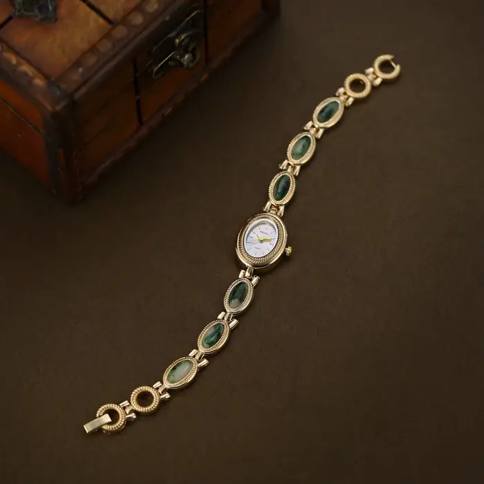 Montre à bracelet incrusté de pierres artificielles pour femmes