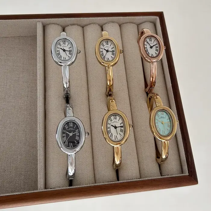 Montre élégante pour femme avec bracelet en alliage, mouvement quartz, cadran ovale, pour occasions spéciales et tous les jours