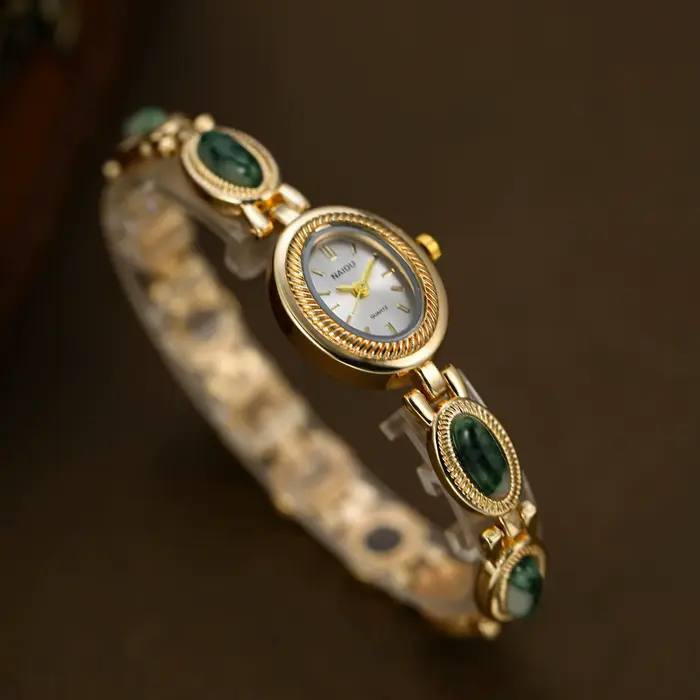 Montre à bracelet incrusté de pierres artificielles pour femmes