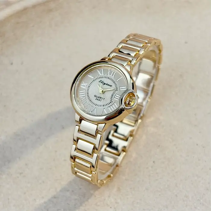 Montre-bracelet élégante pour femmes avec bracelet en acier allié et affichage en chiffres romains pour les occasions spéciales et quotidiennes