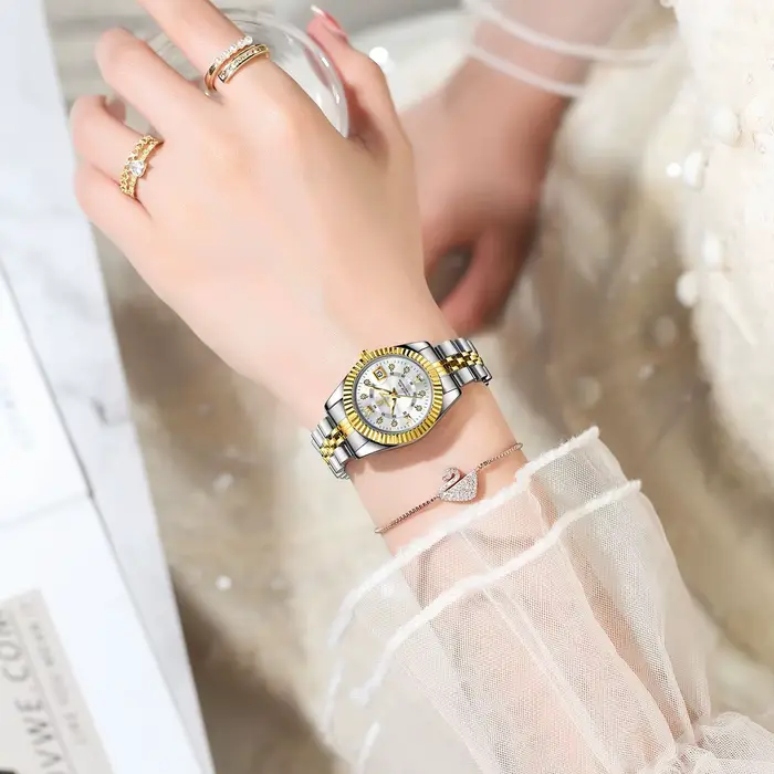 Montre élégante en acier inoxydable avec affichage numérique romain et fonction date automatique pour femmes occasions spéciales