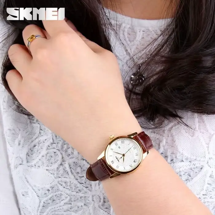 Montre-bracelet en cuir à quartz pour hommes et femmes