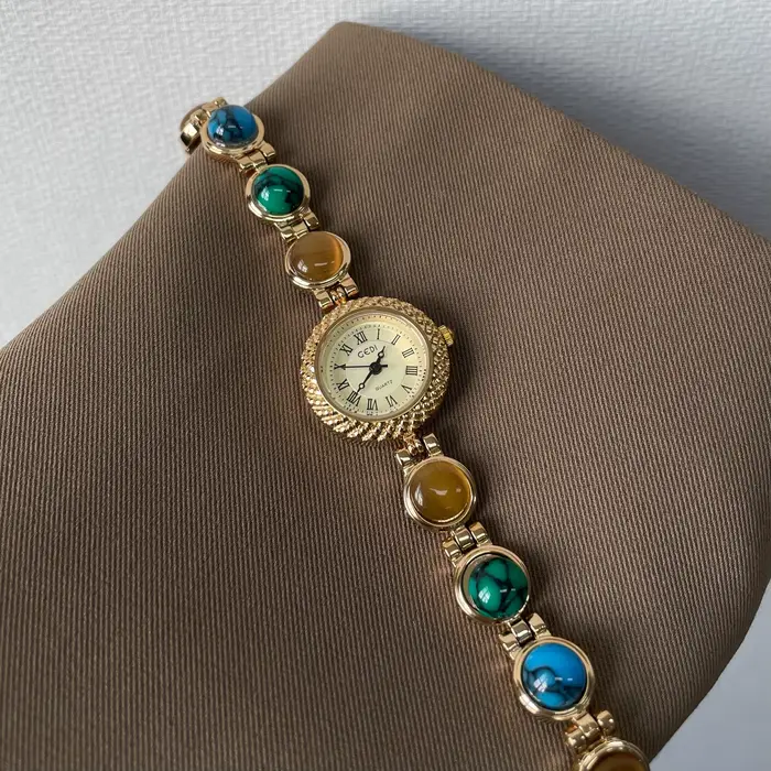 Montre dorée Doudou Design haut de gamme quartz résistante à l'eau pour femmes occasions spéciales élégante à offrir