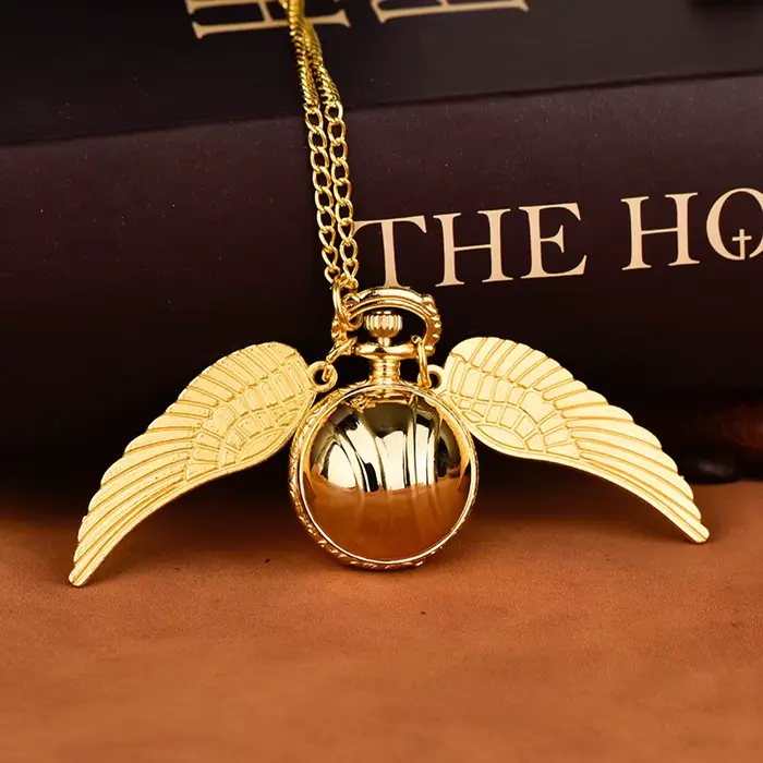 Montre de poche luxueuse avec ailes dorées et citrouille pour homme, élégante et innovante, idéale pour les occasions formelles et informelles