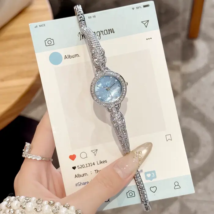 Montre de luxe pour femme avec bracelet argenté tête de léopard, mouvement à quartz, résistante à l'eau, idéale pour mariage et fêtes