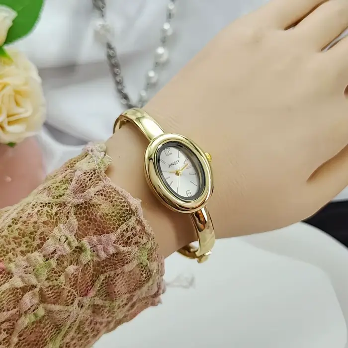 Montre-bracelet dorée en alliage avec bracelet en acier inoxydable pour femmes élégantes occasions spéciales style mode et décontracté