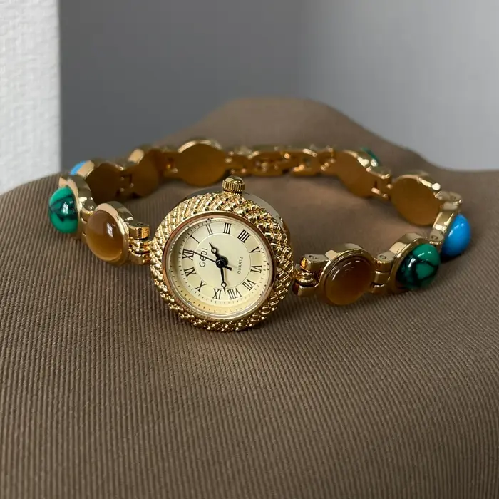 Montre dorée Doudou Design haut de gamme quartz résistante à l'eau pour femmes occasions spéciales élégante à offrir