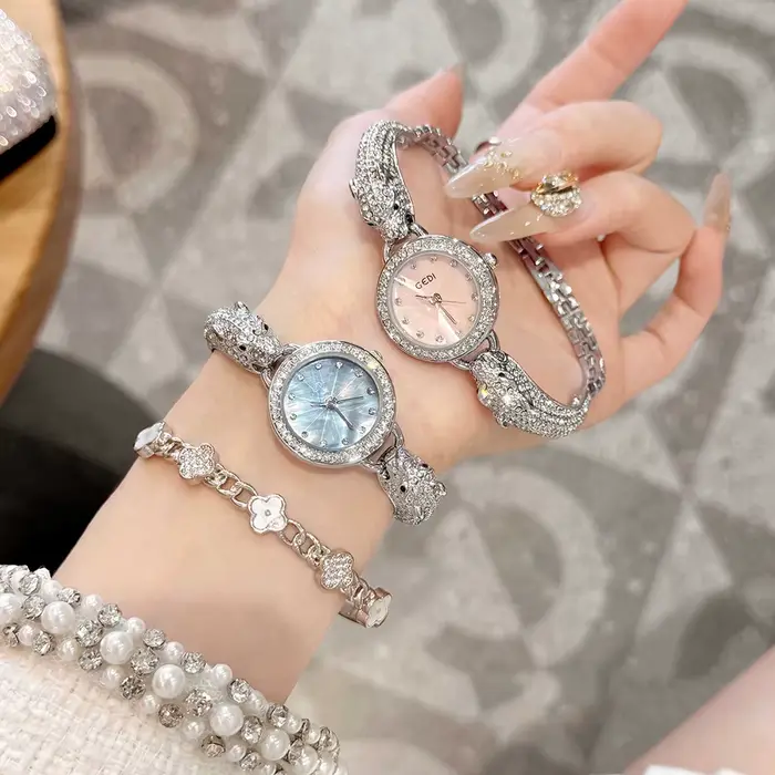 Montre de luxe pour femme avec bracelet argenté tête de léopard, mouvement à quartz, résistante à l'eau, idéale pour mariage et fêtes