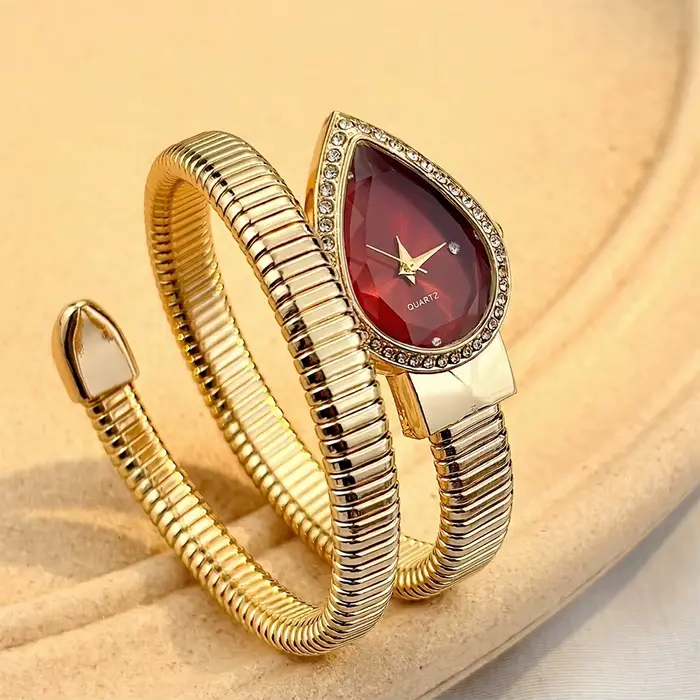 Montre élégante pour femmes avec cadran en forme de goutte d'eau et bracelet en forme de serpent