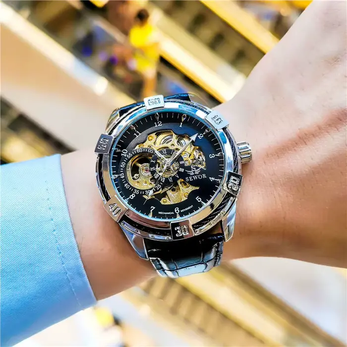 Nouvelle montre mécanique automatique haut de gamme avec design creux double face pour hommes