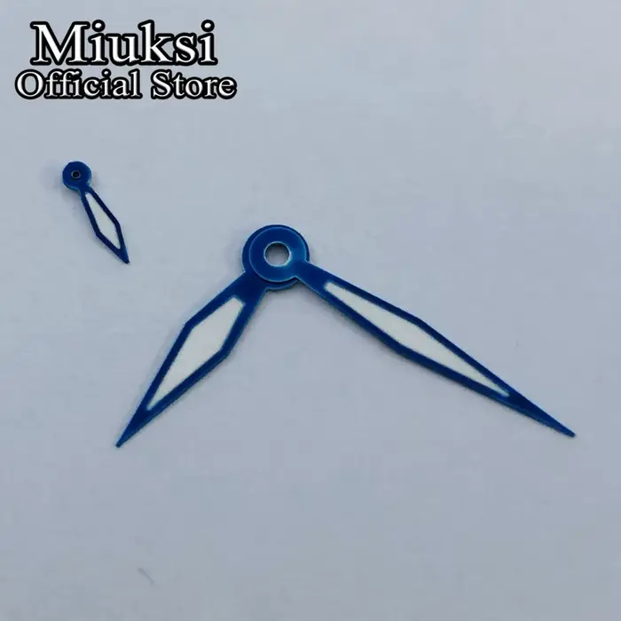 Miuksi – aiguilles de montre argent or noir blanc