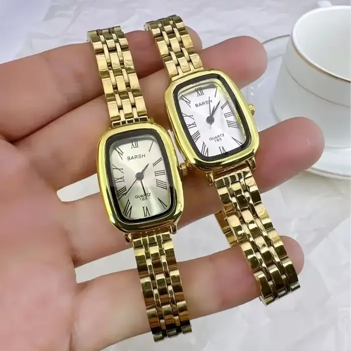 Montre en or avec ceinture en acier pour femme