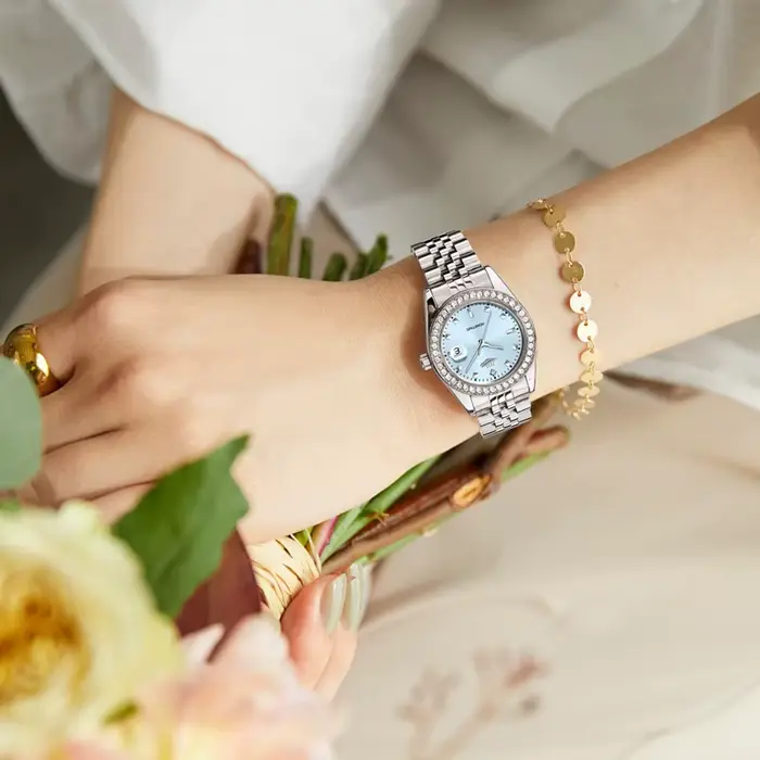 Montre à Quartz Luxe Femmes Planète Collection Calendrier Lumineux Bracelet Acier Occasions Spéciales Robuste et Élégante