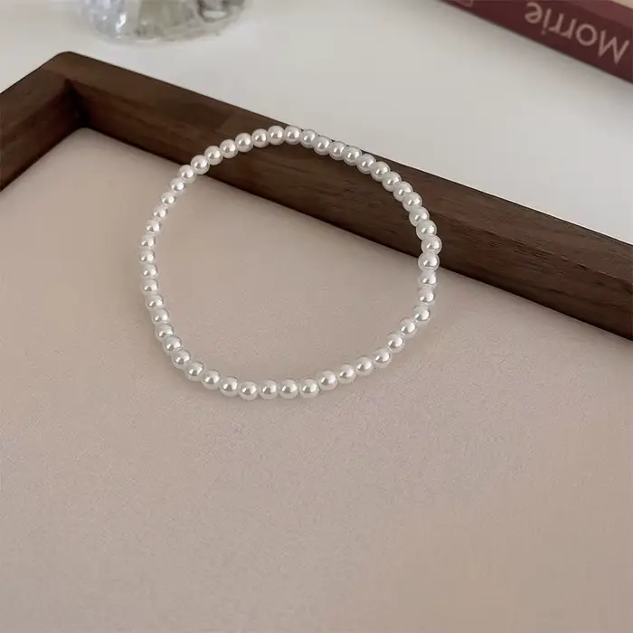 Bracelets élégants en fausses perles blanches pour femmes, corde élastique réglable, accessoires de