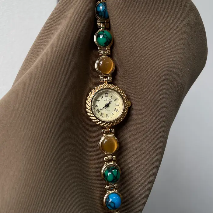 Montre dorée Doudou Design haut de gamme quartz résistante à l'eau pour femmes occasions spéciales élégante à offrir