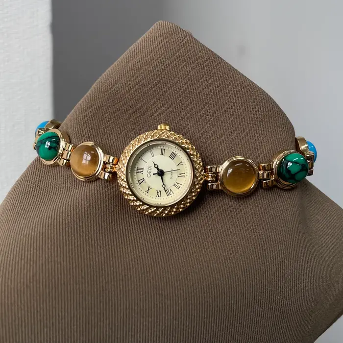 Montre dorée Doudou Design haut de gamme quartz résistante à l'eau pour femmes occasions spéciales élégante à offrir