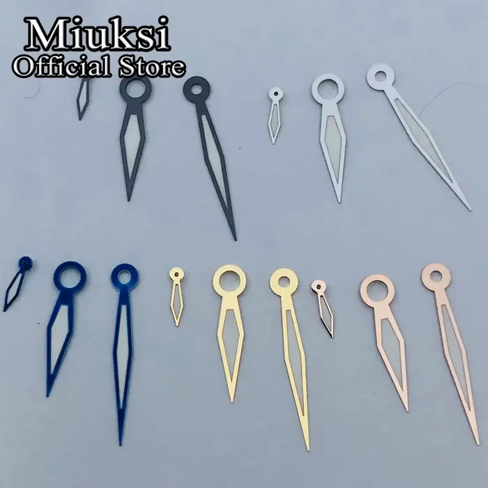 Miuksi – aiguilles de montre argent or noir blanc