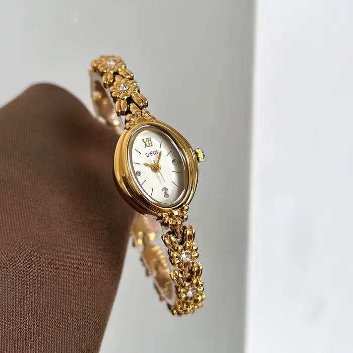 Montre pour femme en alliage avec incrustations de diamants style rétro mode et décontracté pour occasions spéciales