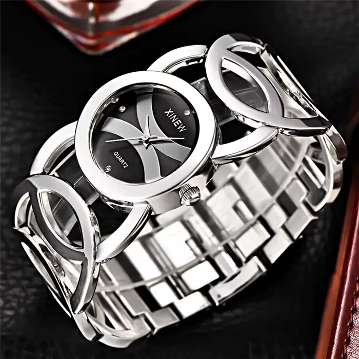 Montre de luxe XINEW en acier inoxydable avec mouvement à quartz pour femmes, élégante et résistante, idéale pour les occasions spéciales et le quotidien