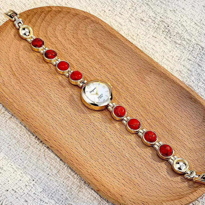 Montre-bracelet vintage pour femme ornée de pierres - Exquise