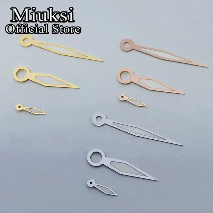 Miuksi – aiguilles de montre argent or noir blanc