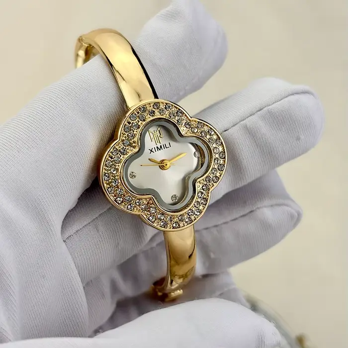Montre-bracelet vintage en forme de trèfle à quatre feuilles pour femmes