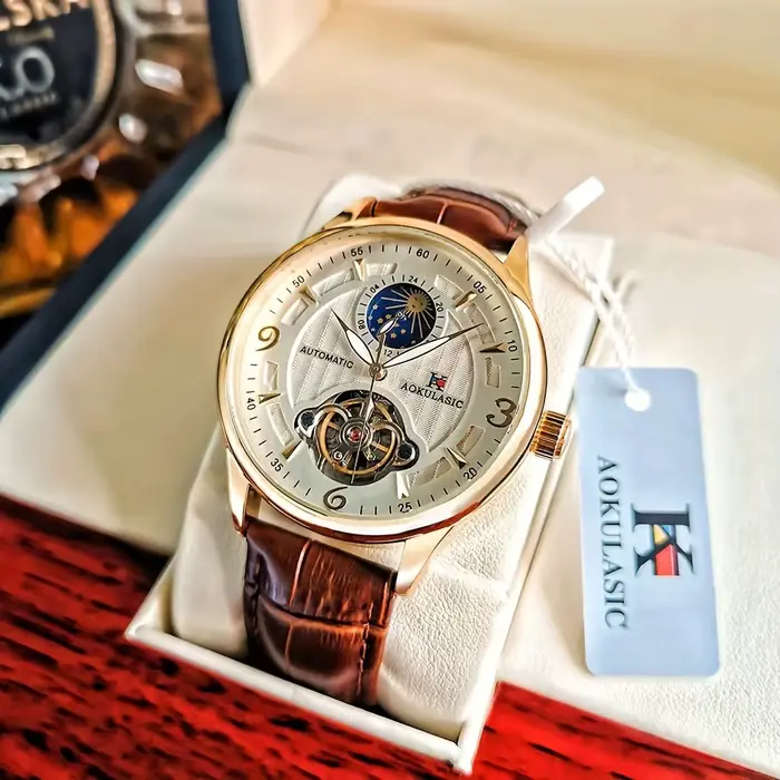 Montre mécanique de luxe AOKULASIC avec cadran squelette et bracelet en cuir pour homme style business occasions spéciales