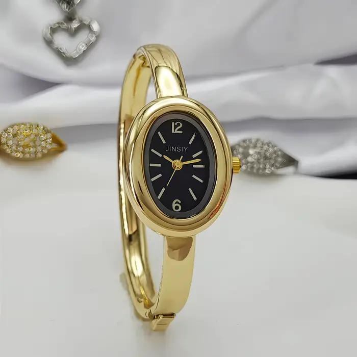 Montre-bracelet dorée en alliage avec bracelet en acier inoxydable pour femmes élégantes occasions spéciales style mode et décontracté
